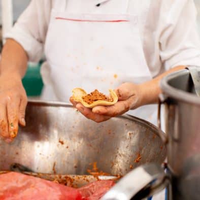 Delicious tacos al pastor being prepared at Lagunilla Market in Mexico City.