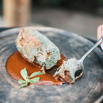 Delicious traditional dish served with rich sauce, perfect for exploring Juarez culinary highlights.