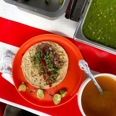 Vibrant street food with fresh lime and flavorful sauces.