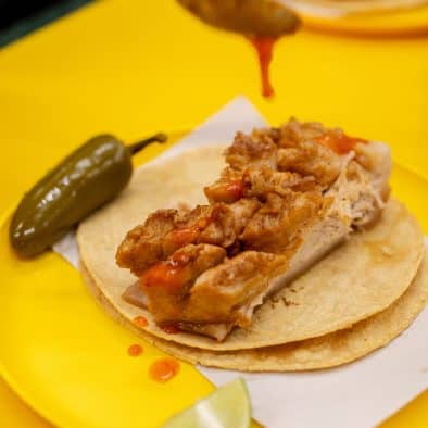 Tacos de barbacoa with lime and chili at Central de Abastos, Mexico City.
